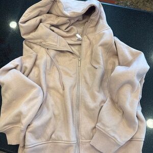 Blush colored zip-up hoodie